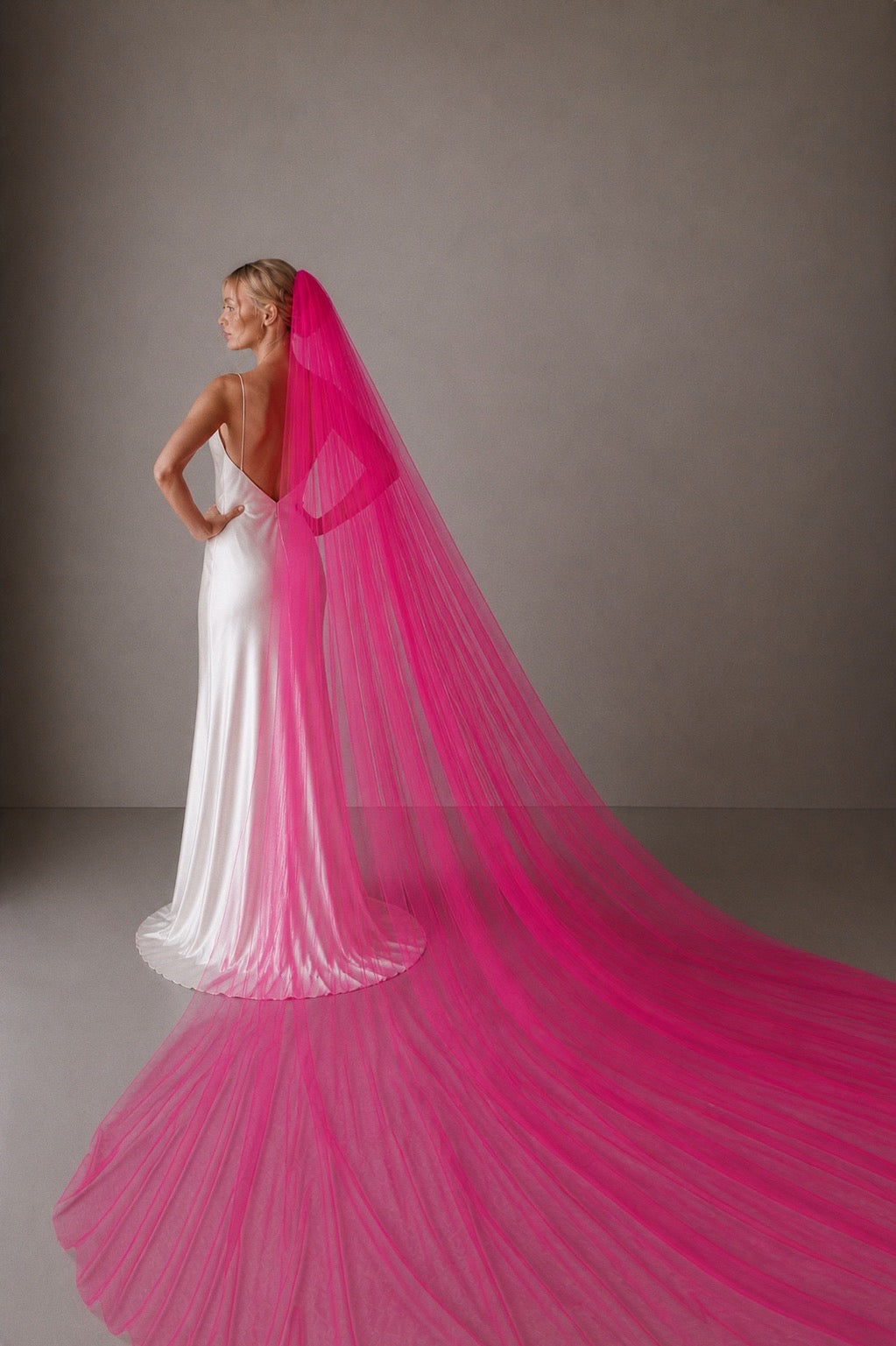 hot pink tulle wedding veil full width cathedral length dramatic bridal veil back view