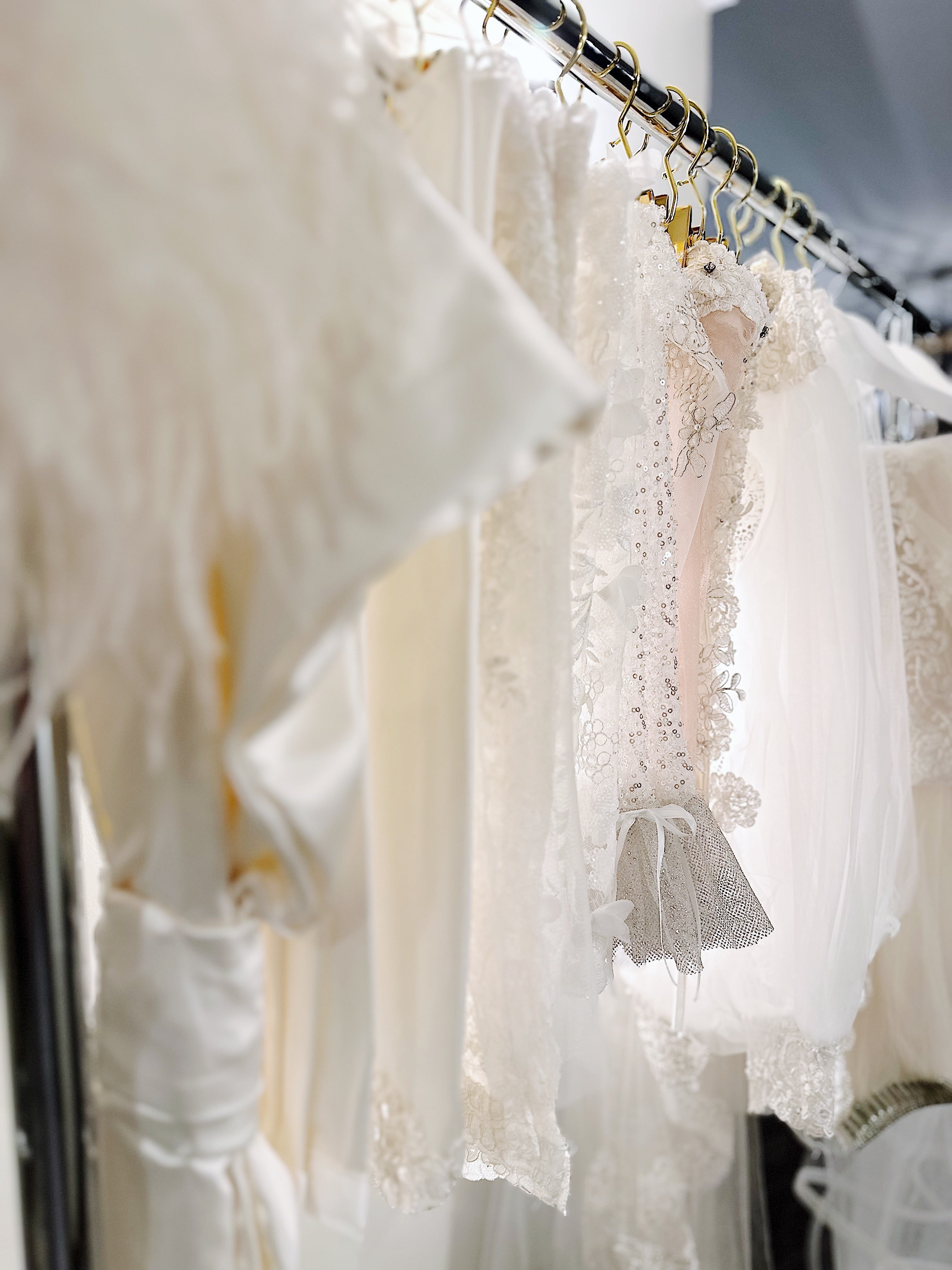 Accessories and Veils hanging on racks inside the Lauren Elaine Los Angeles Bridal Salon