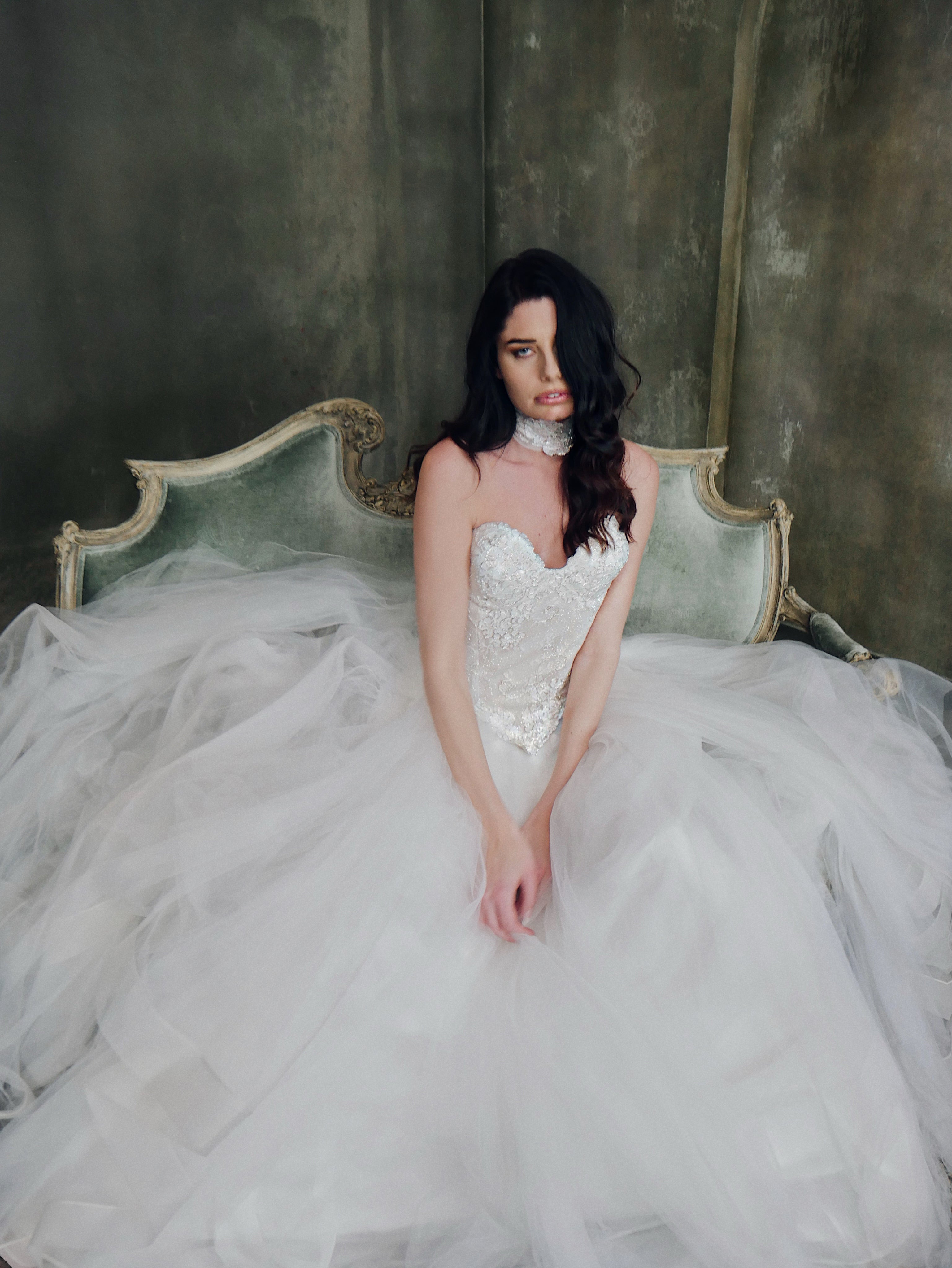 A model wears the Lauren Elaine "Regency" basque waist  lace bridal corset w/"Regalia" skirt.