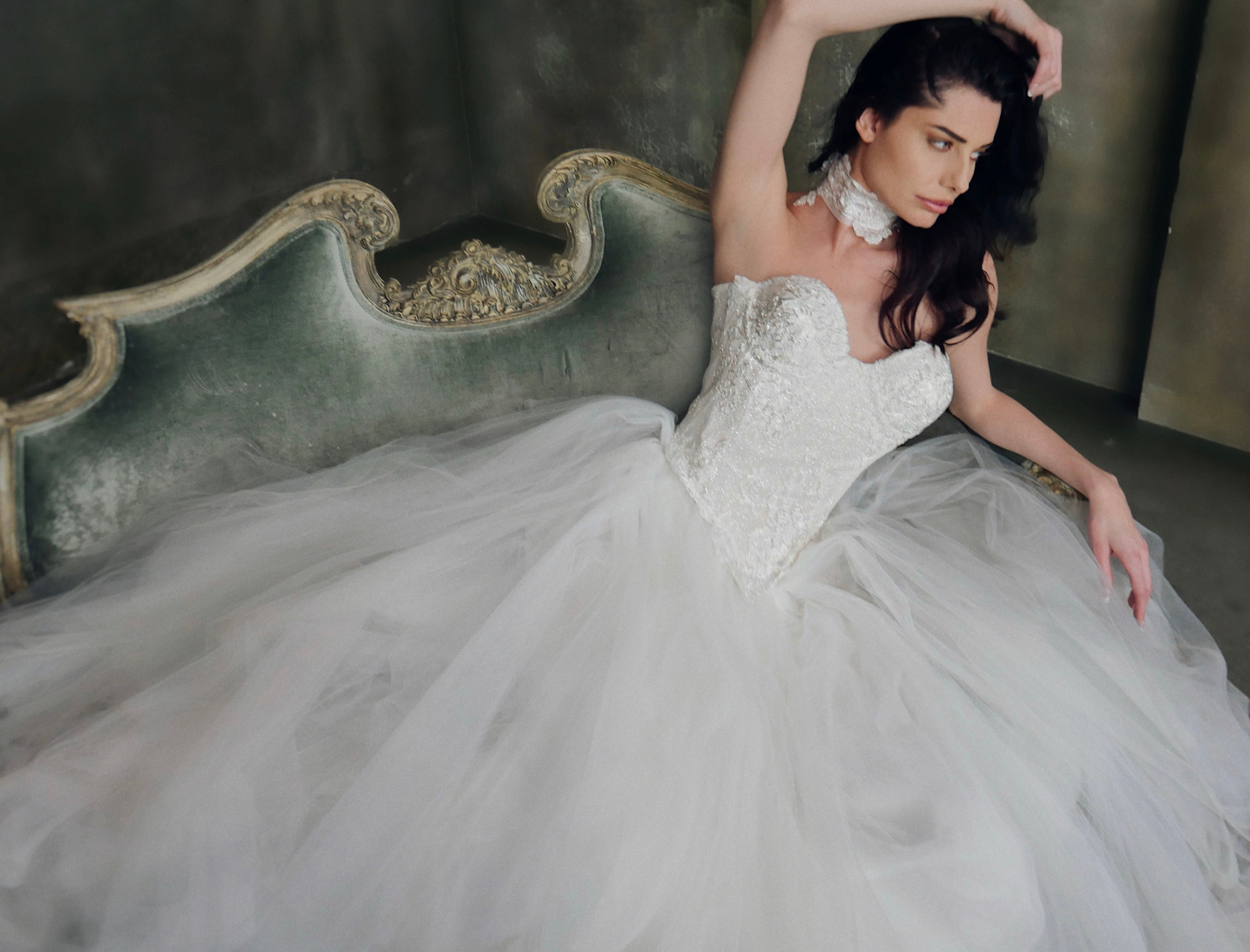 A model wears the Lauren Elaine "Regency" basque waist lace bridal corset w/"Regalia" skirt.