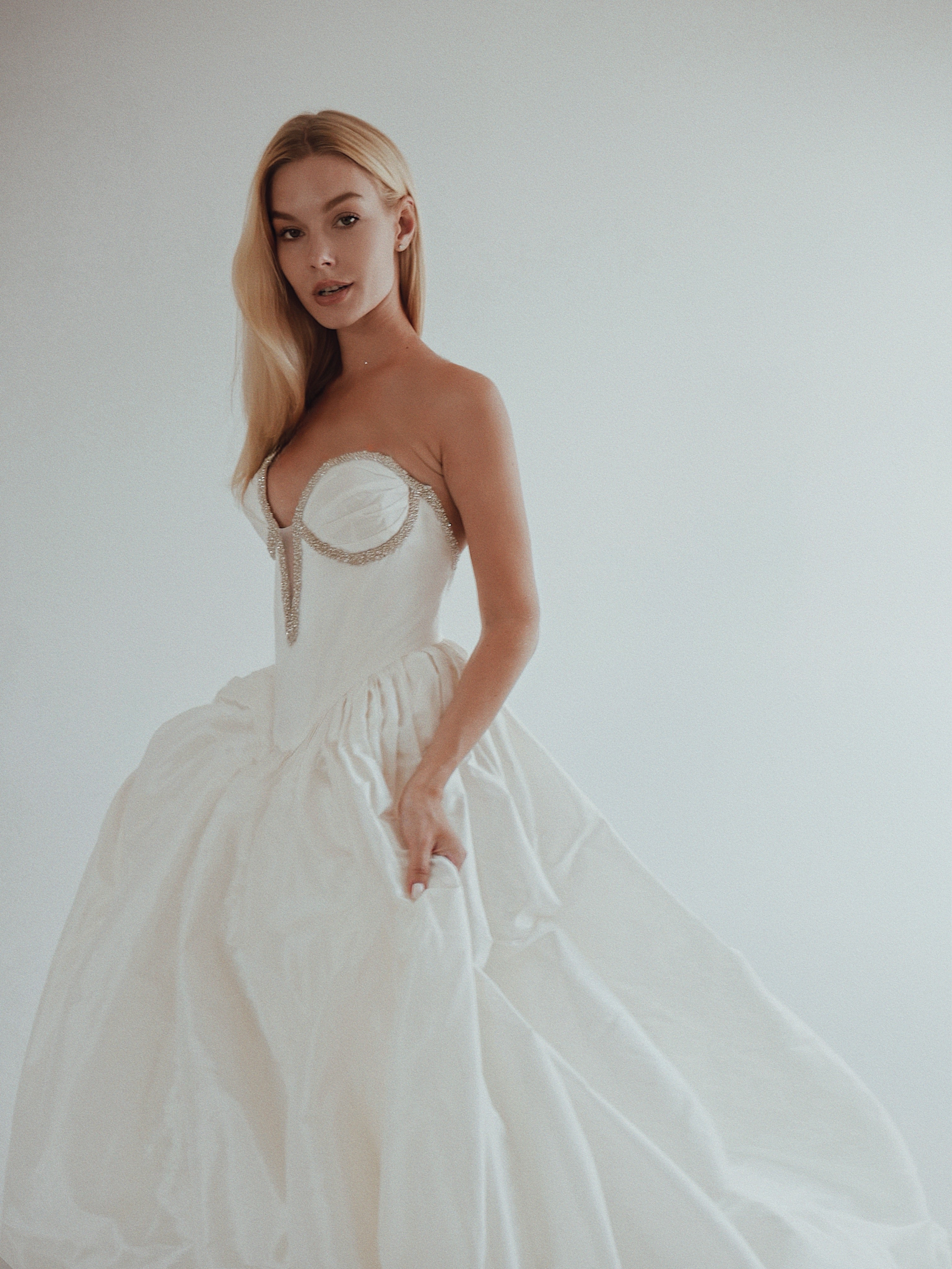 Lauren Elaine basque waist corset wedding dress photographed in a studio