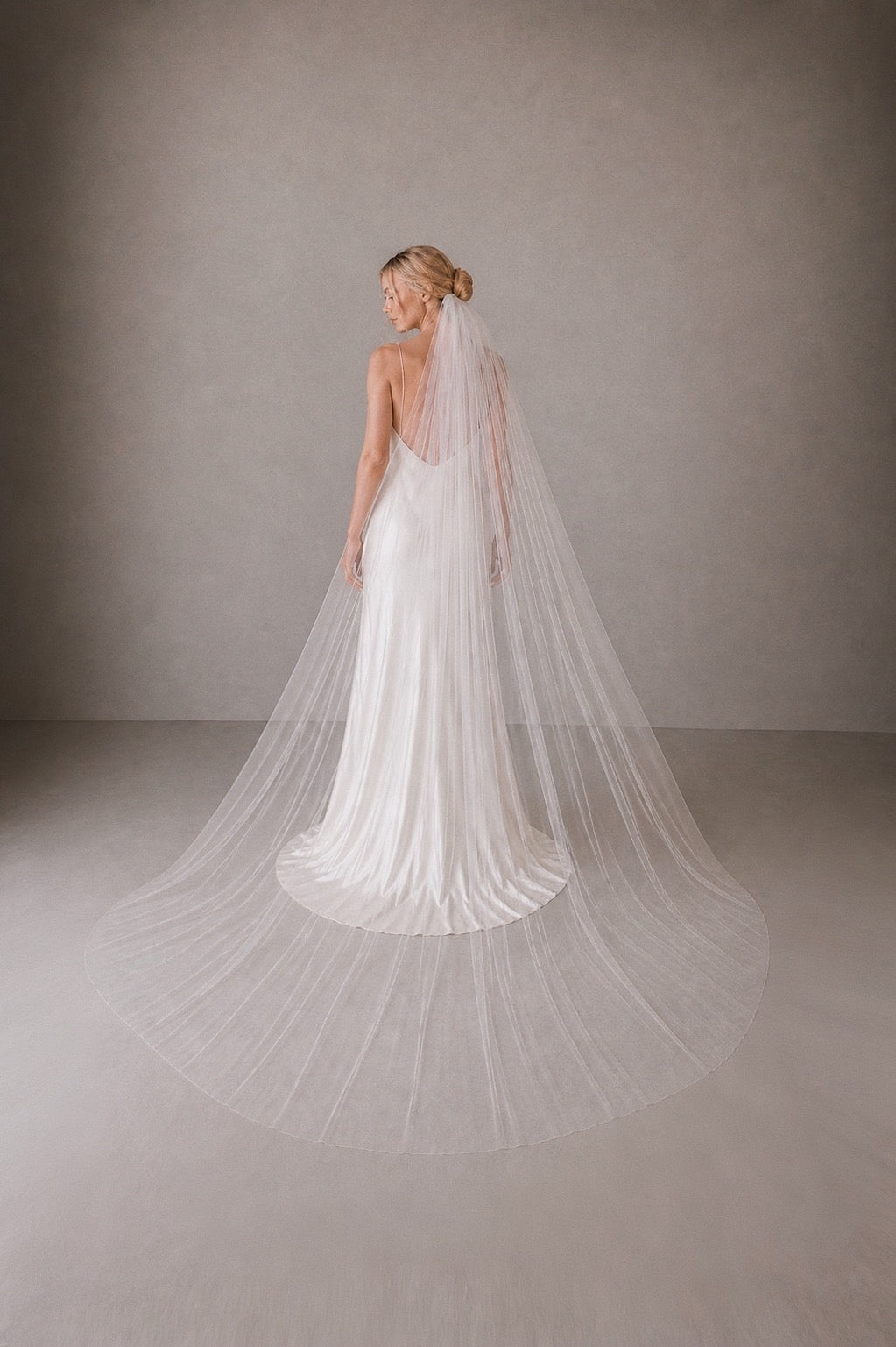 off white tulle wedding veil full width chapel length simple bridal veil raw edge back view