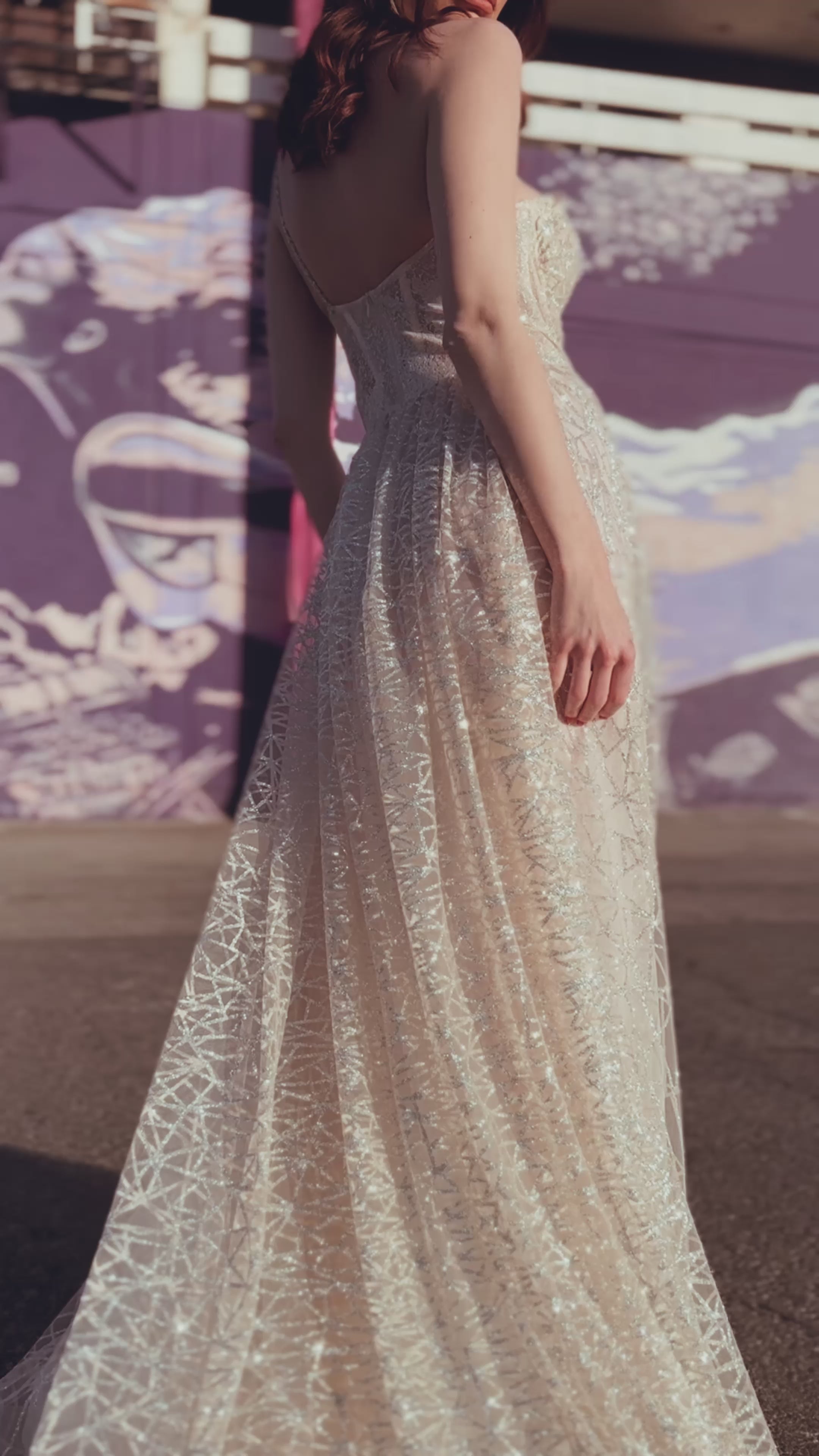 A model wears the Lauren Elaine Prima sparkle corset wedding dress in downtown Las Vegas, NV.