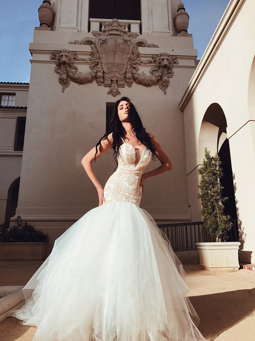 Sequin blush mermaid wedding dress with deep v illusion neckline and 8ft cathedral train
