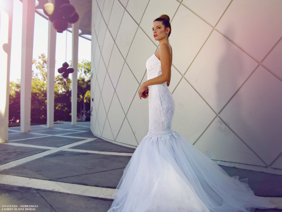 Dramatic form-fitted mermaid gown with pearl and sequin lace. Train. Open back.