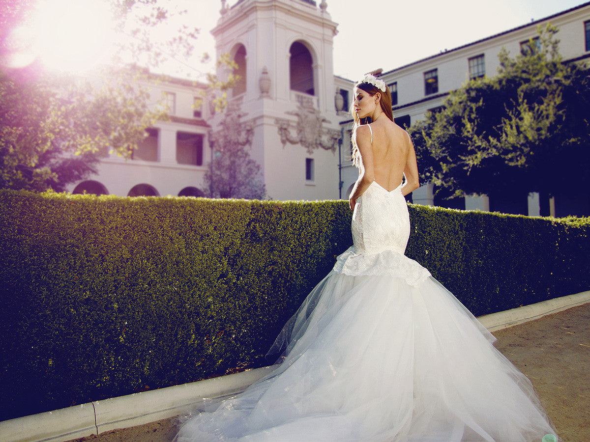 Backless mermaid wedding gown with cathedral train and spaghetti straps