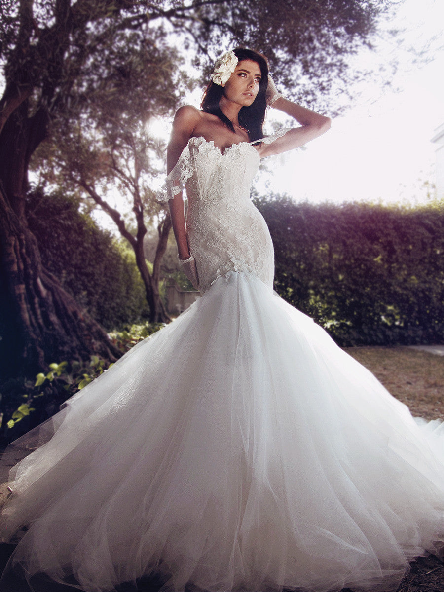 Off-the-shoulder mermaid wedding gown with lace appliqué detailing and cathedral tulle train