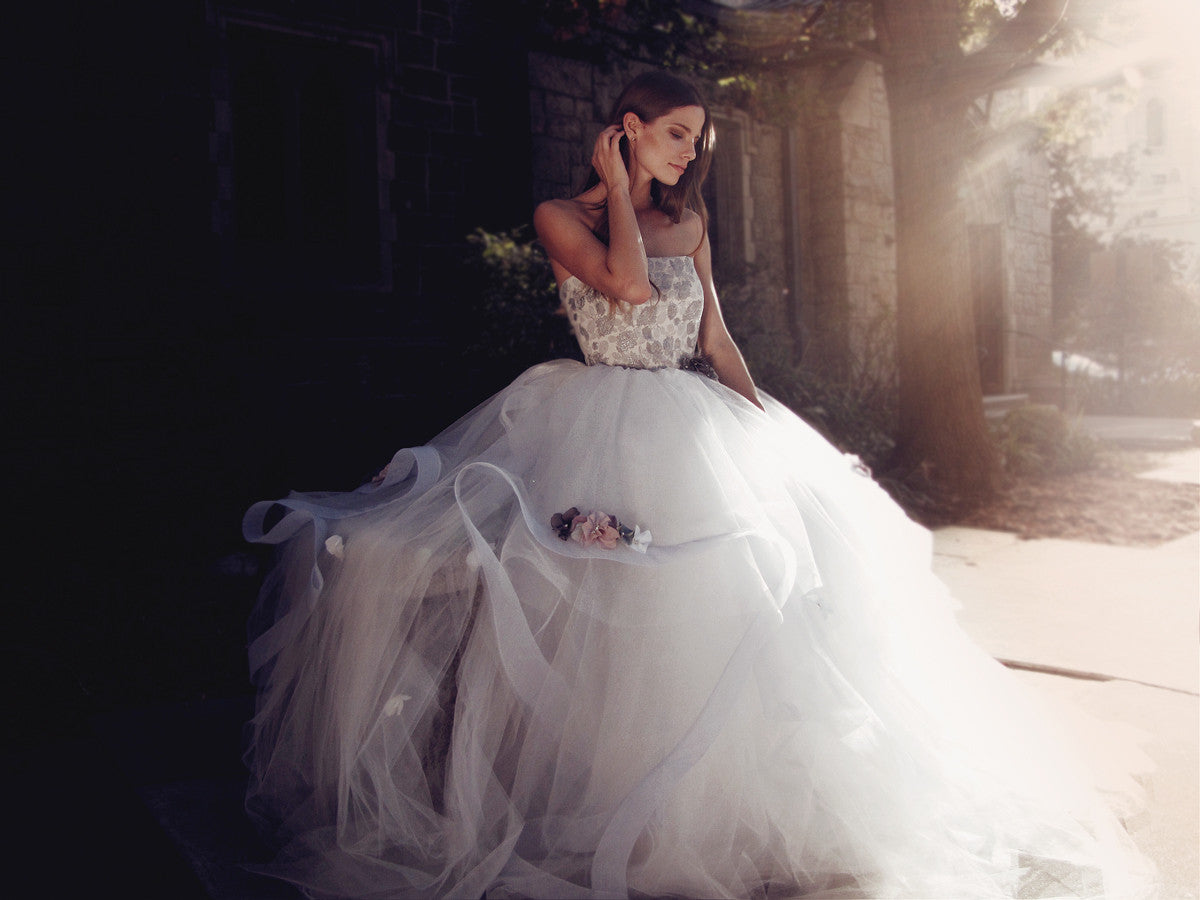 Ethereal and bohemian ball gown wedding dress in pewter mist blue with rainbow flowers and strapless corset bodice.