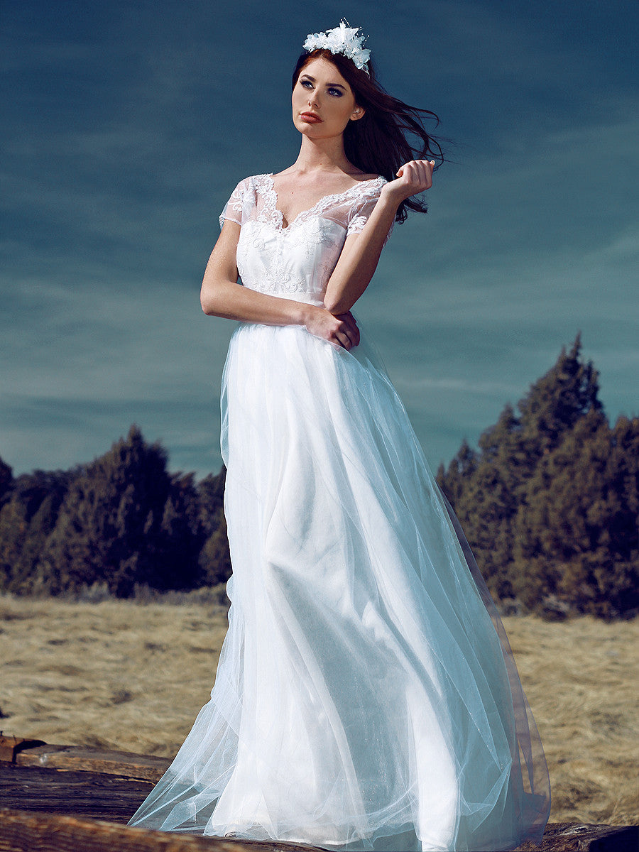 A-line tulle and lace illusion sleeve wedding gown. Briar Rose by Lauren Elaine.