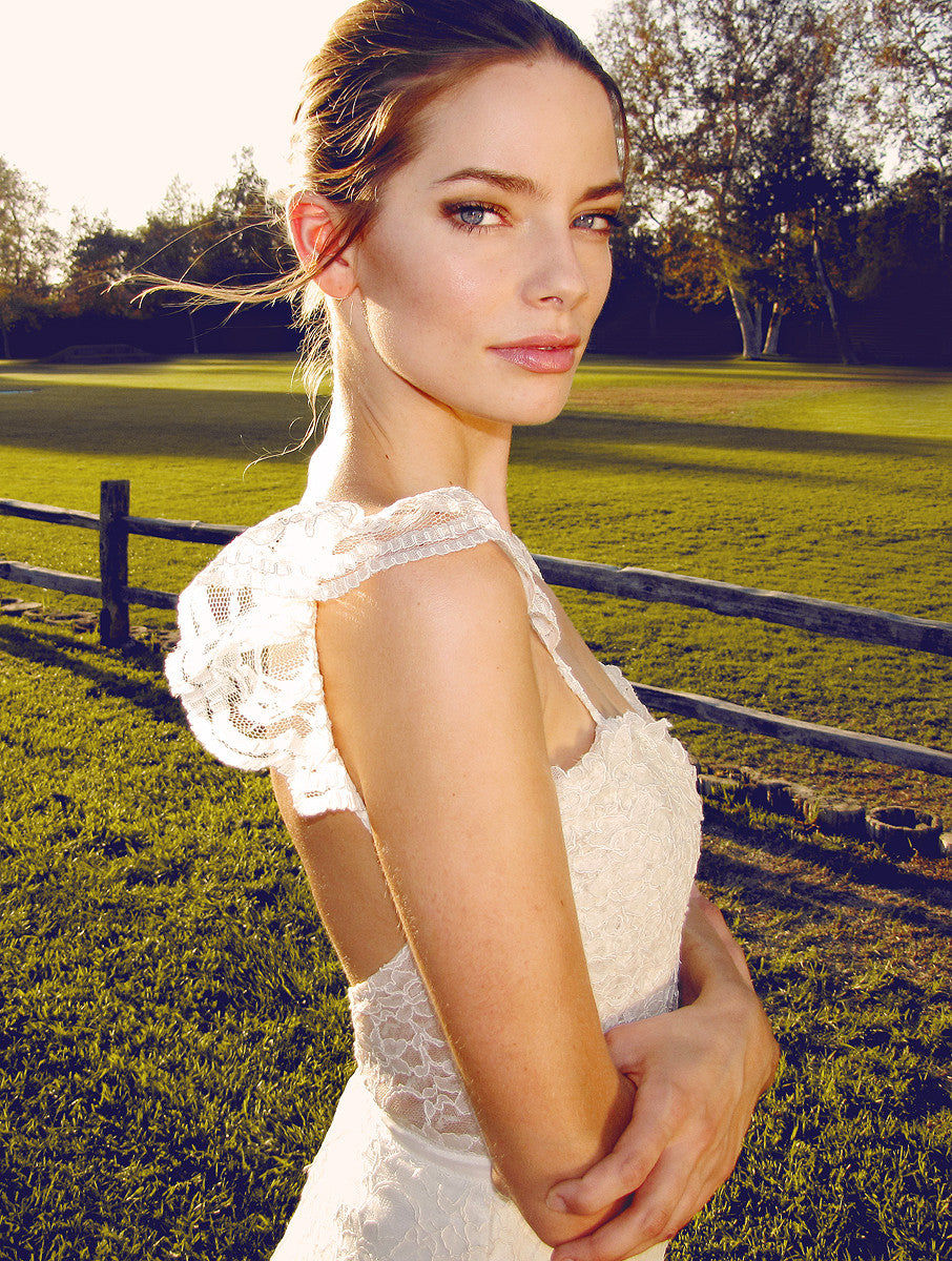 Vintage backless bridal gown with lace sleeves and train. made in the usa.