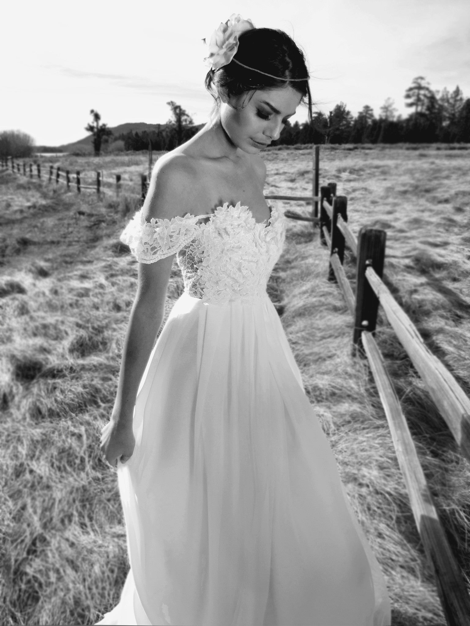 Vintage lace and chiffon off-the-shoulder wedding gown with backless illusion A-line silhouette.