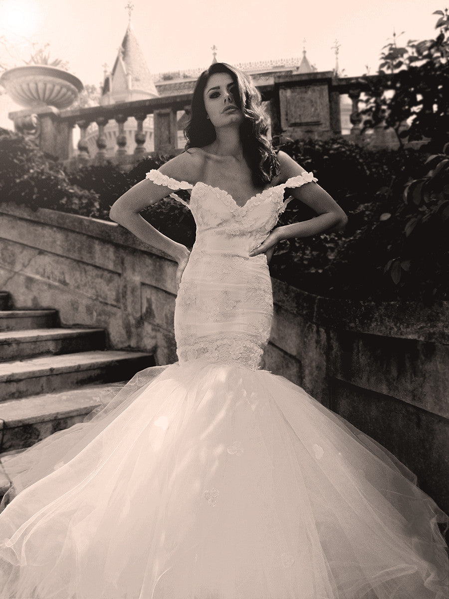 Off the shoulder mermaid wedding gown. French corded lace and rosettes. Lauren Elaine Bridal.