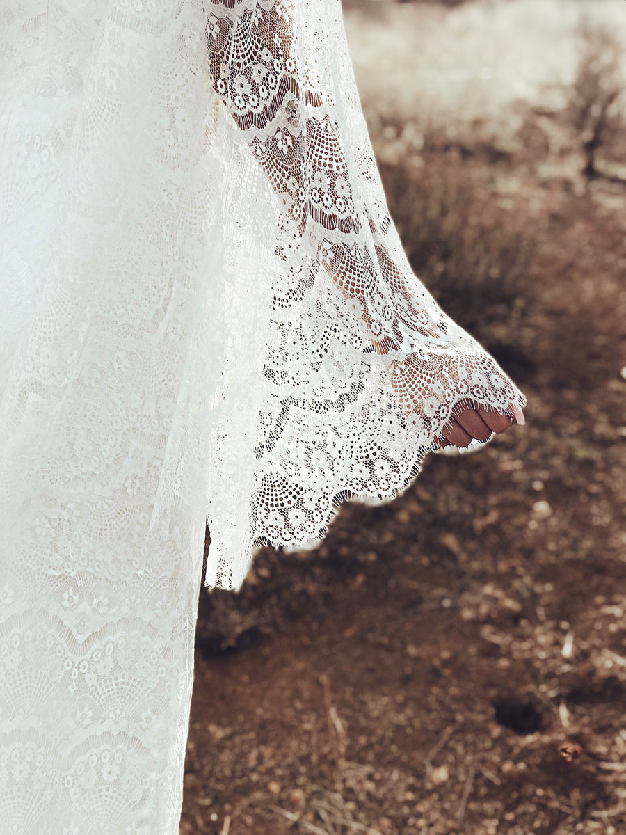 Eyelash lace scallop detailing on the cape sleeves of the Lauren Elaine "Larkin" wedding dress.