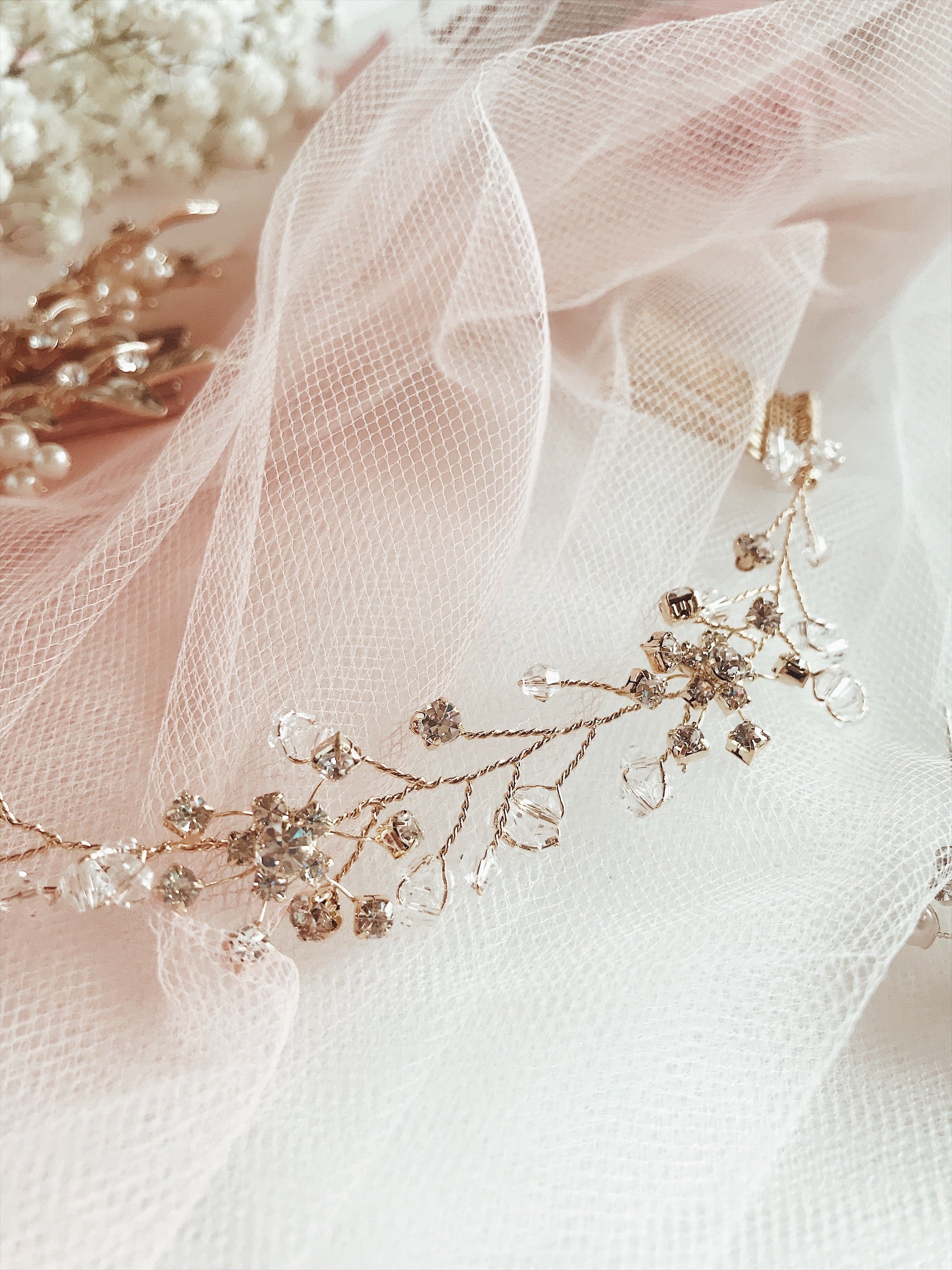 Swarovski crystals and rose gold accents on the "Laurel" hair vine and tiara by Lauren Elaine Bridal Accessories