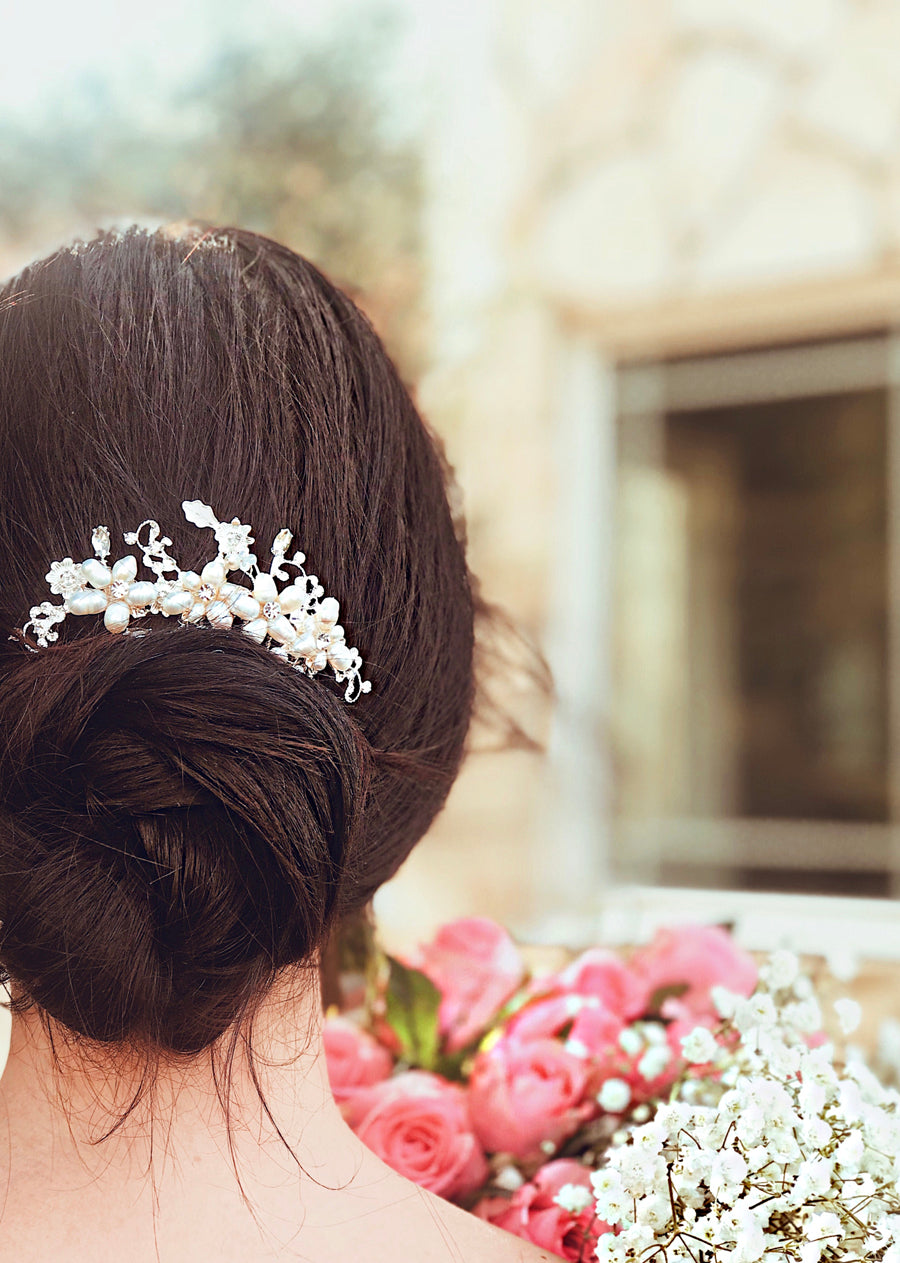 A bride wears the "Lilac" pearl and crystal wedding hair comb by Lauren Elaine Bridal
