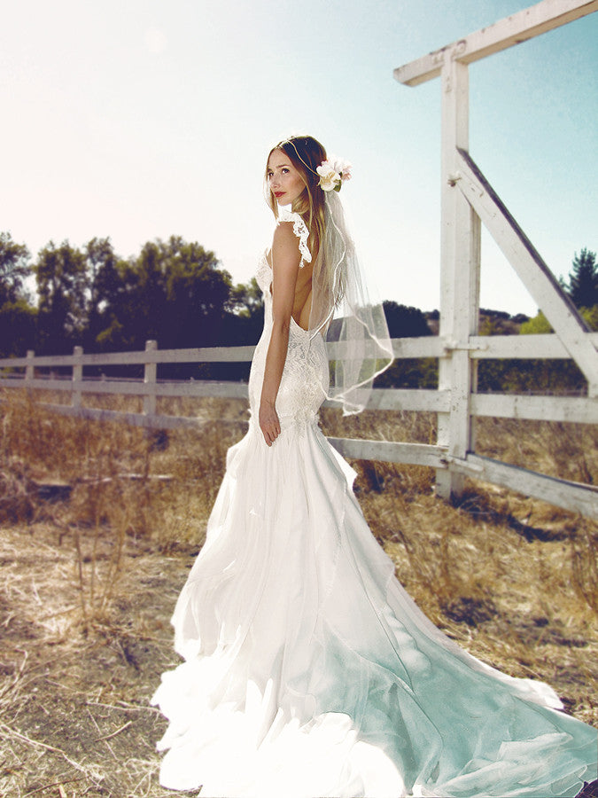 Bohemian wedding gowns by Lauren Elaine. Backless mermaid Aislin gown with chiffon train.