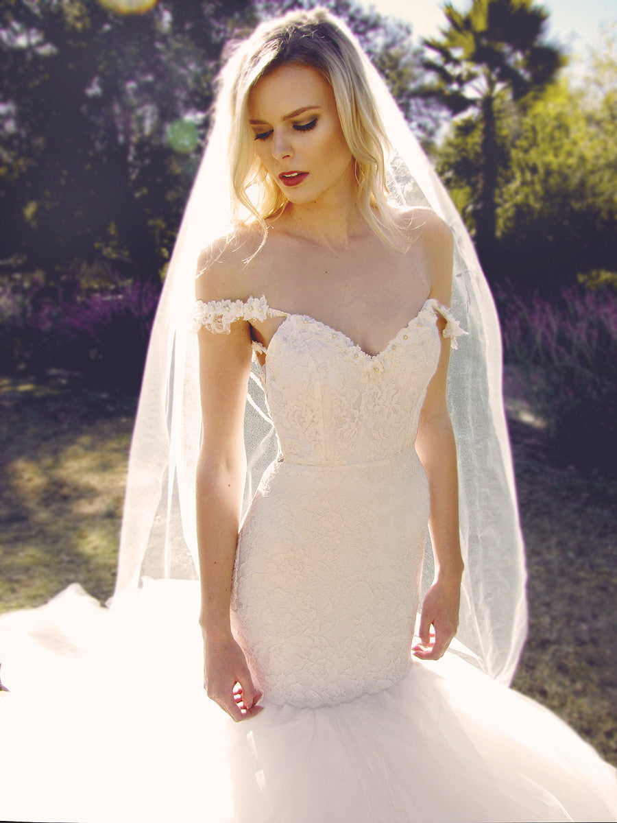 Off-the-Shoulder wedding gowns by Lauren Elaine Bridal. Lace mermaid wedding gown.