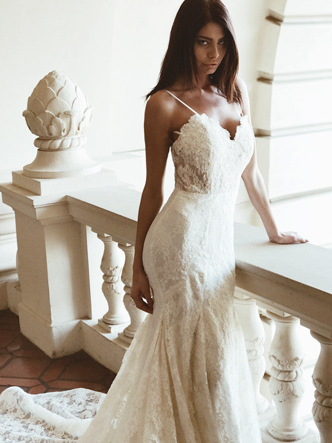 Sweetheart lace illusion mermaid wedding gown with cathedral train and kick pleat detailing by Lauren Elaine Bridal.